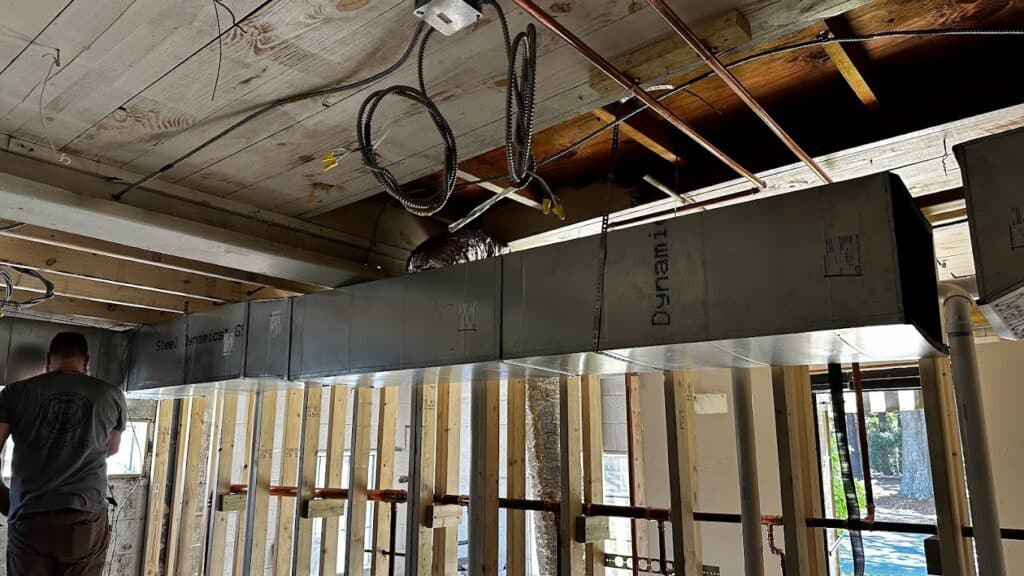 metal ductwork being installed by Service Emperor